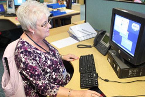 Woman working on a black computer